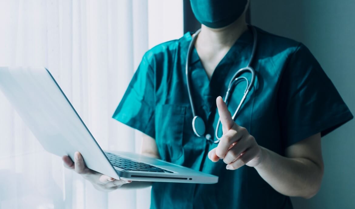 Nurse holding laptop