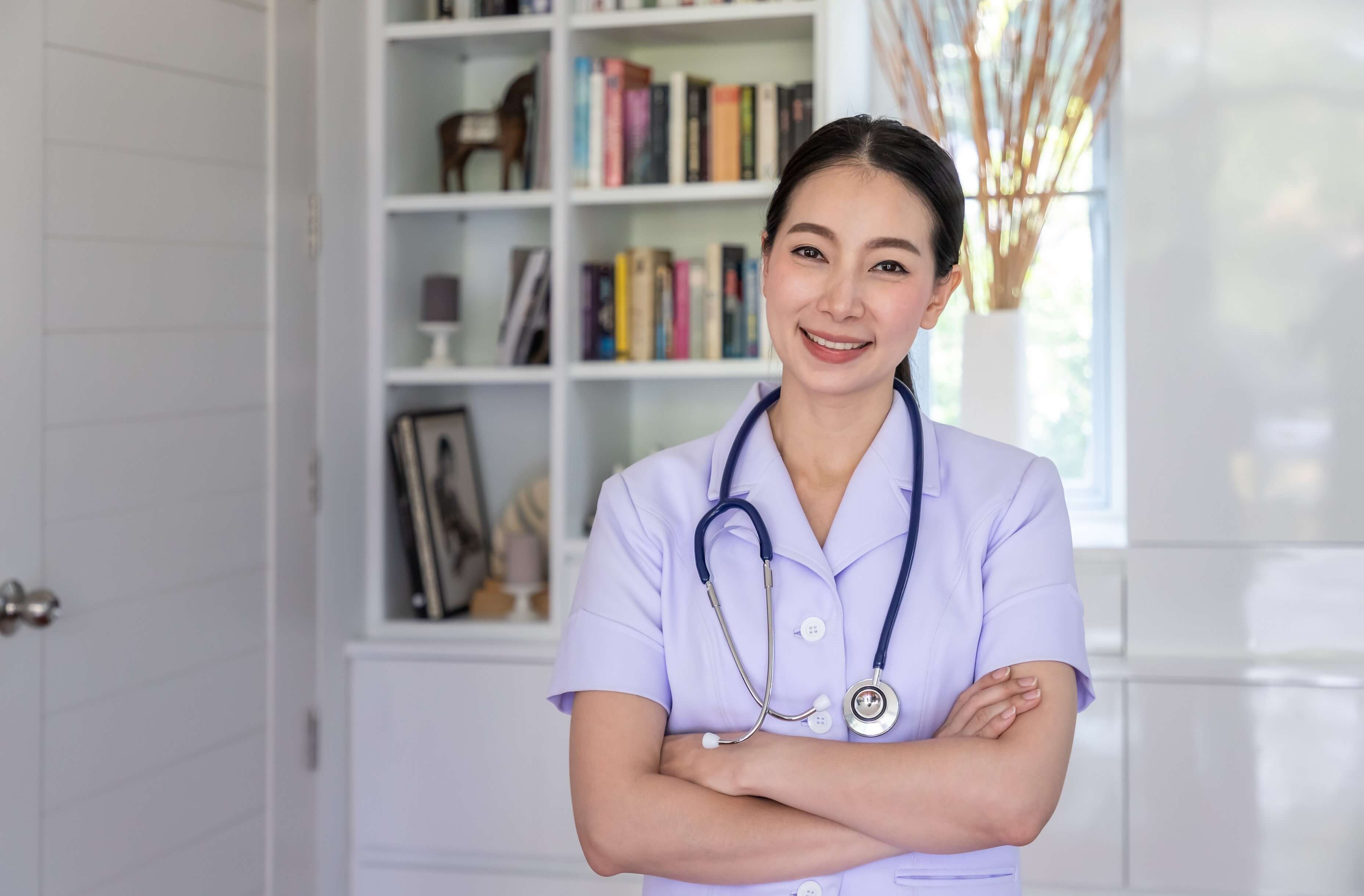 Portrait of Smiling Asian Nurse - crossed arms