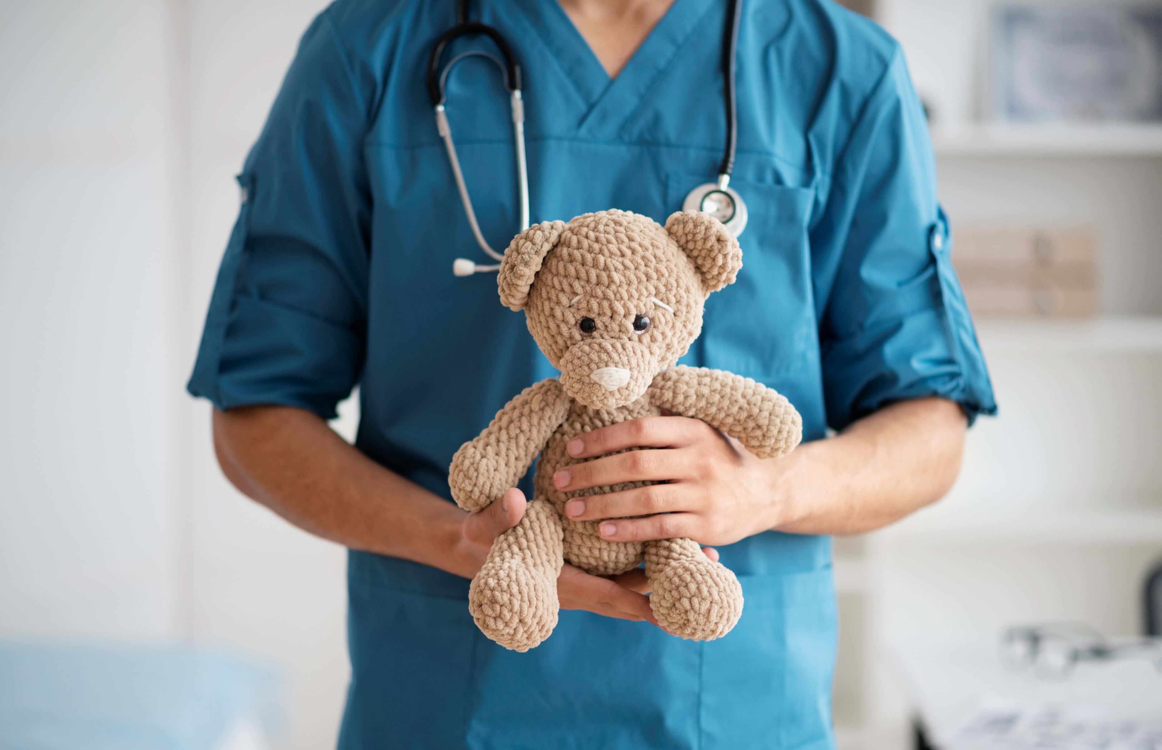 Pediatric Nurse holding a child's toy
