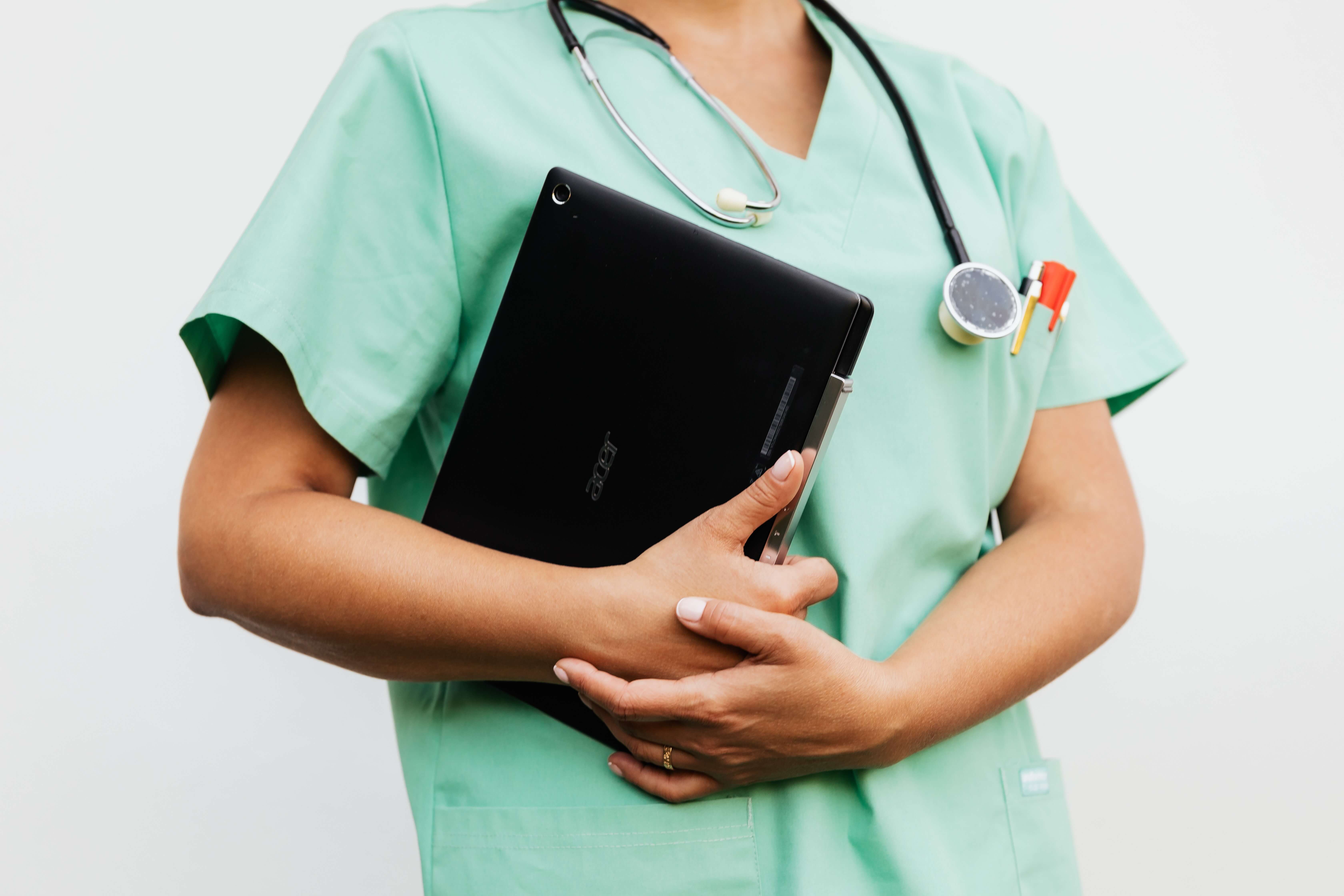 Nurse holding a tablet