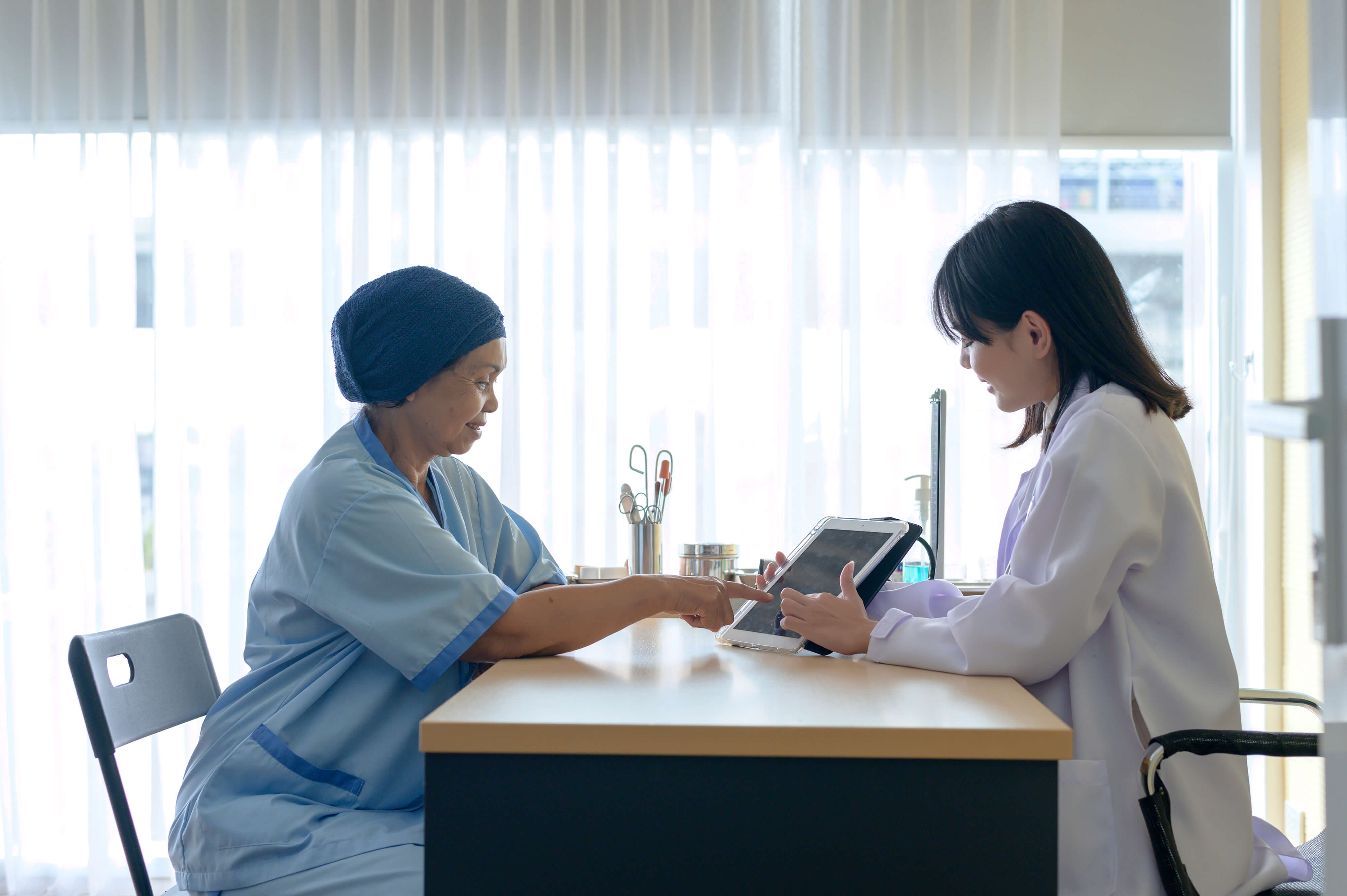 Cancer Patient and a Doctor having conversation