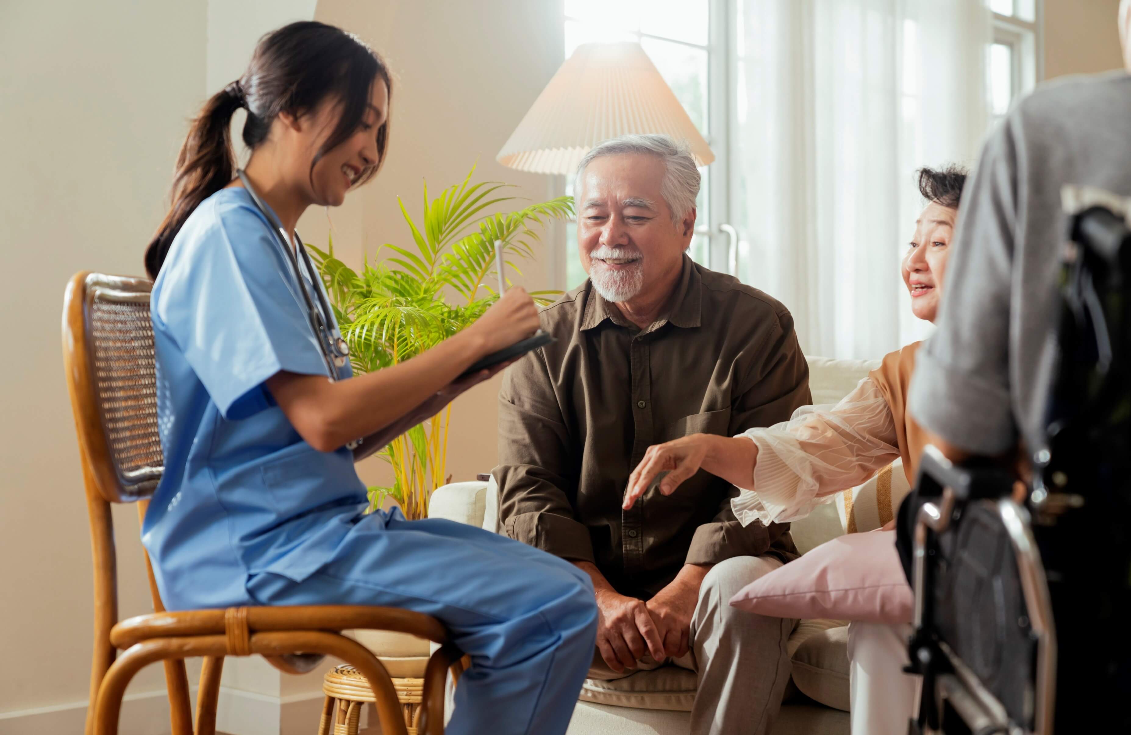 Nurse talking to patient and patient family to educate them